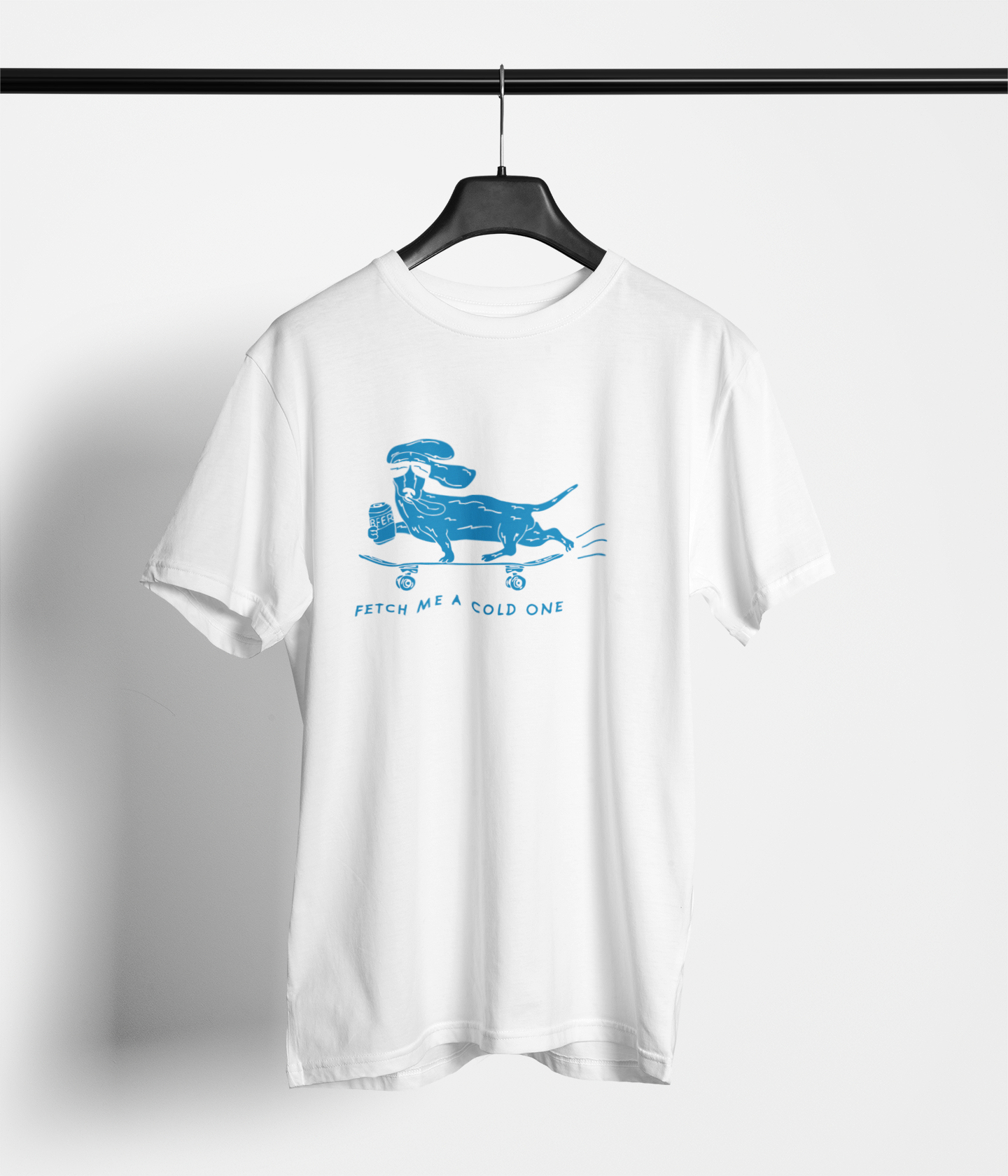 White t-shirt with “Fetch Me a Cold One” skateboarding dog graphic