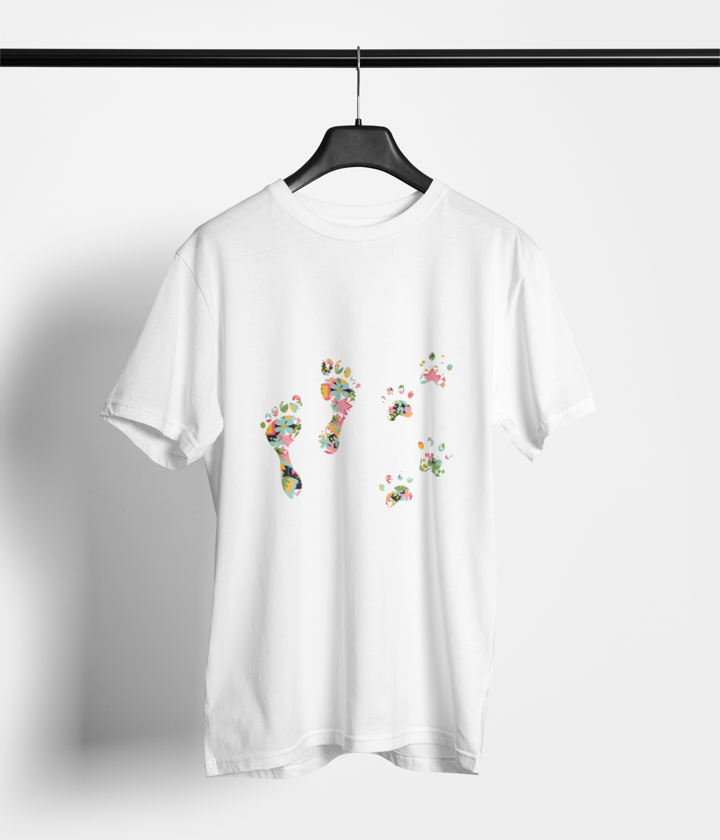 White tee with colorful floral human footprints and dog paw prints